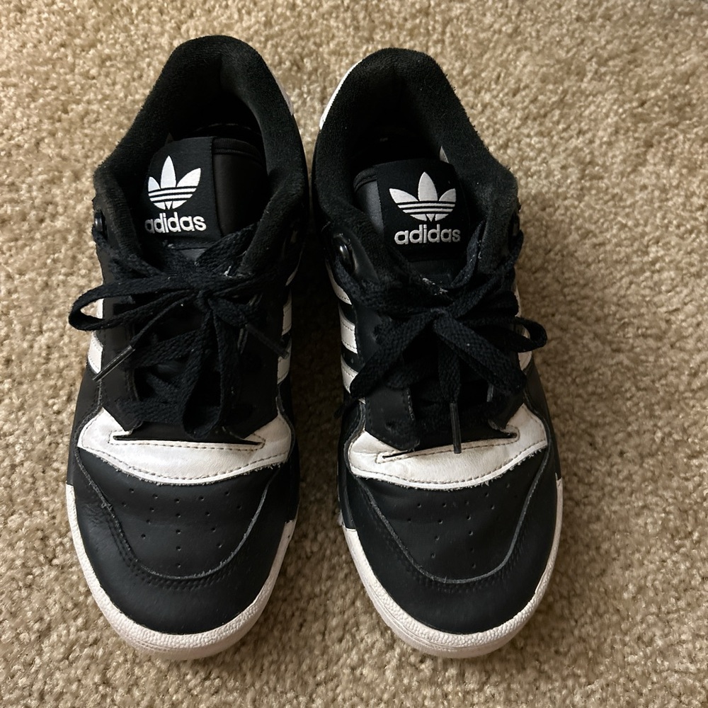 Black and white adidas shoes